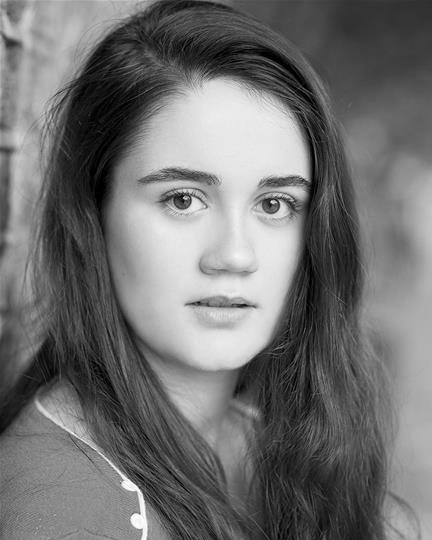 Black and white headshot of Lara Lewis