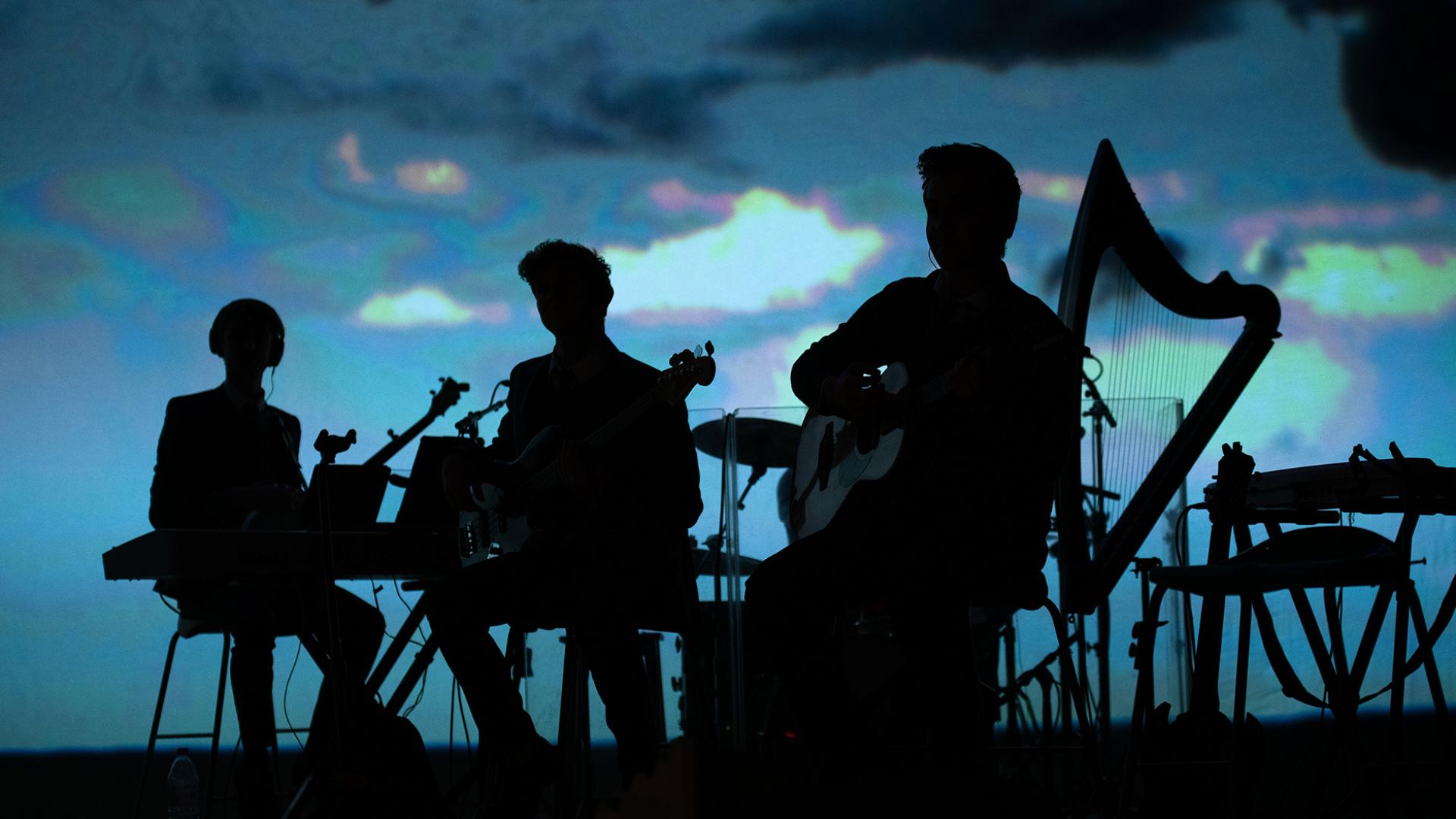 The band in silhouette 