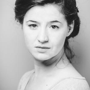 Black and white headshot of Louise Collins