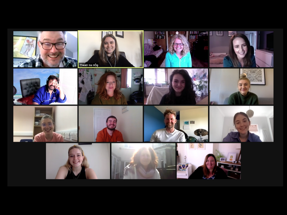 A screenshot of 15 people in individual boxes smiling on Zoom