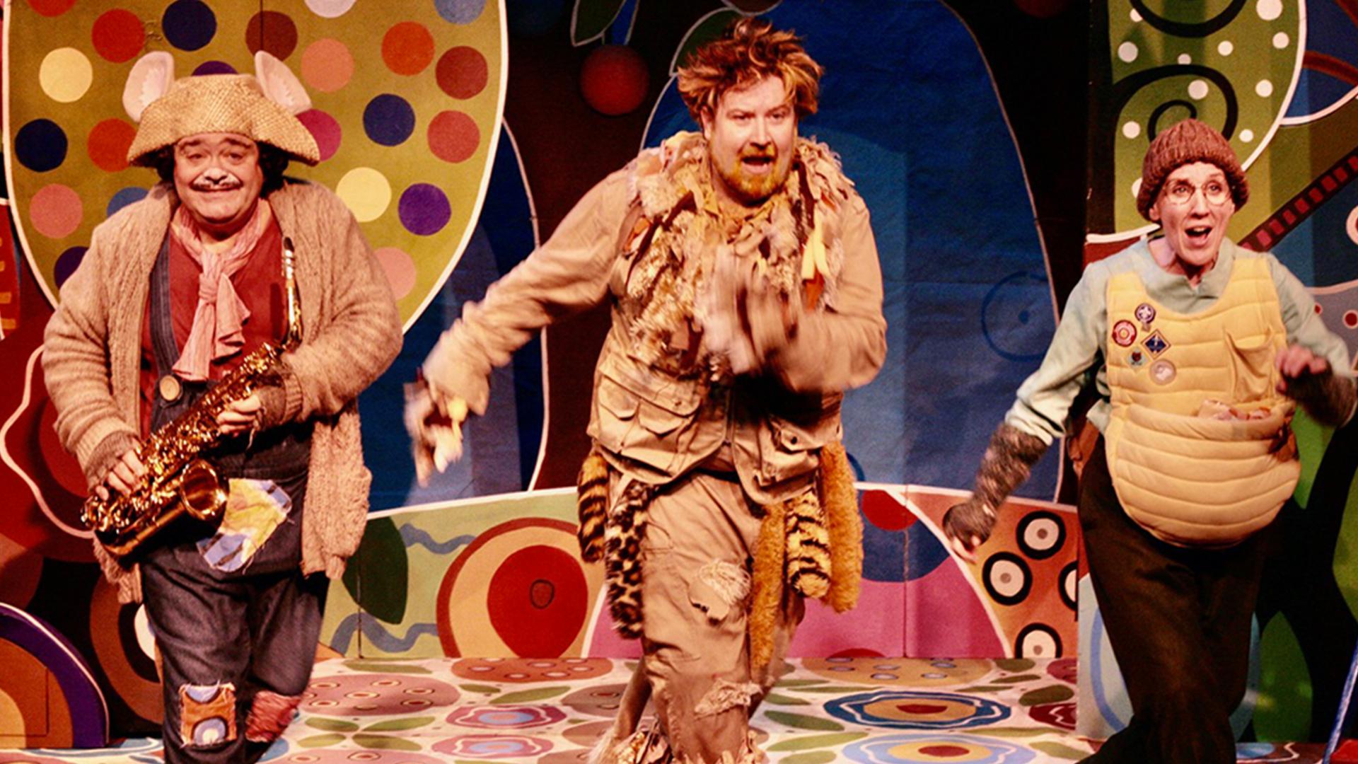 Actors dressed as a mouse, lion and tortoise.