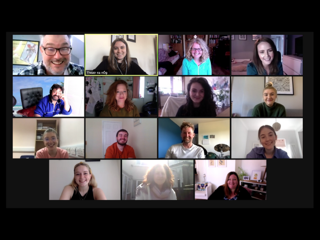 A screenshot of 15 people in individual boxes smiling on Zoom