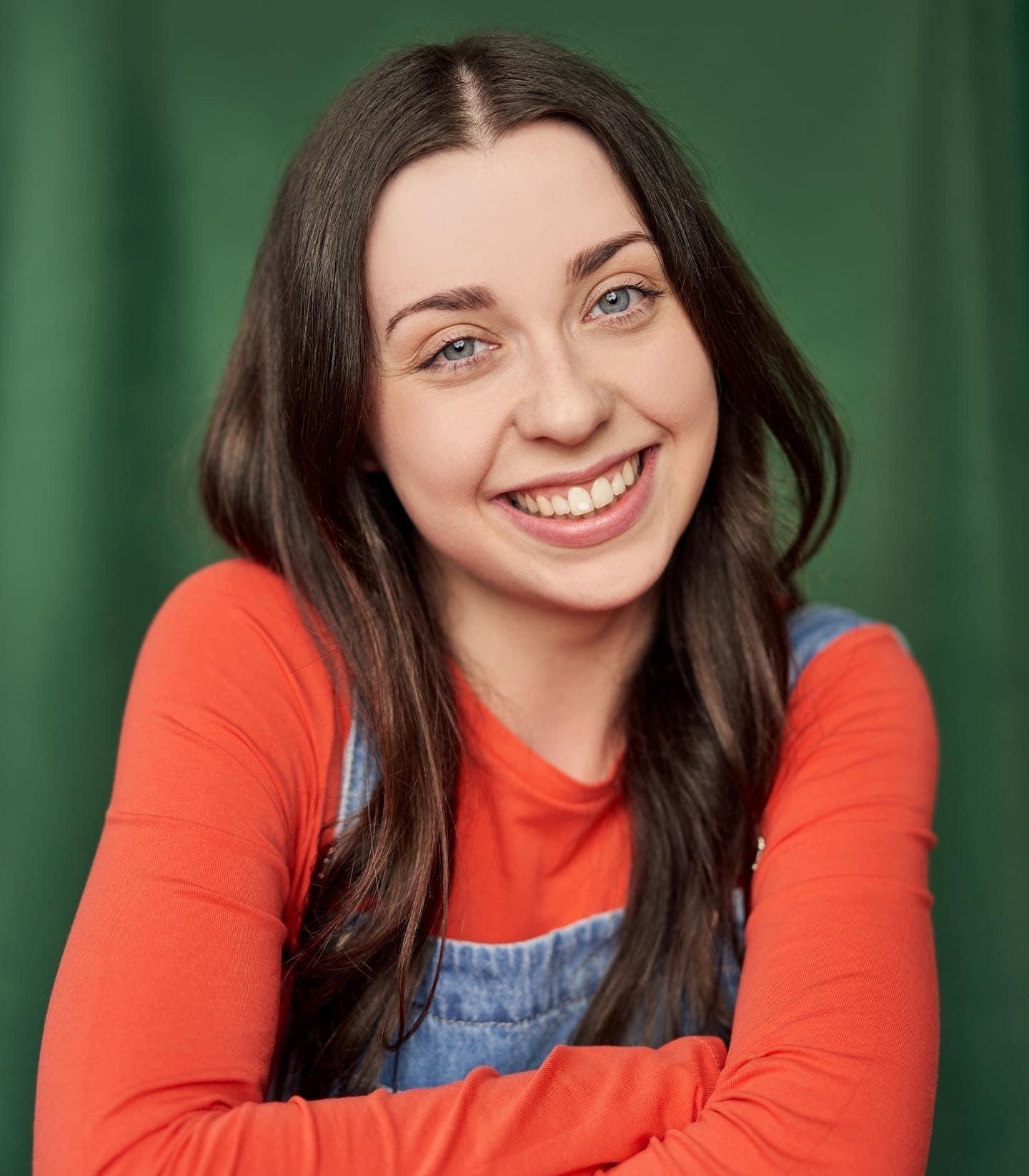 White woman in her twenties with long brown hair