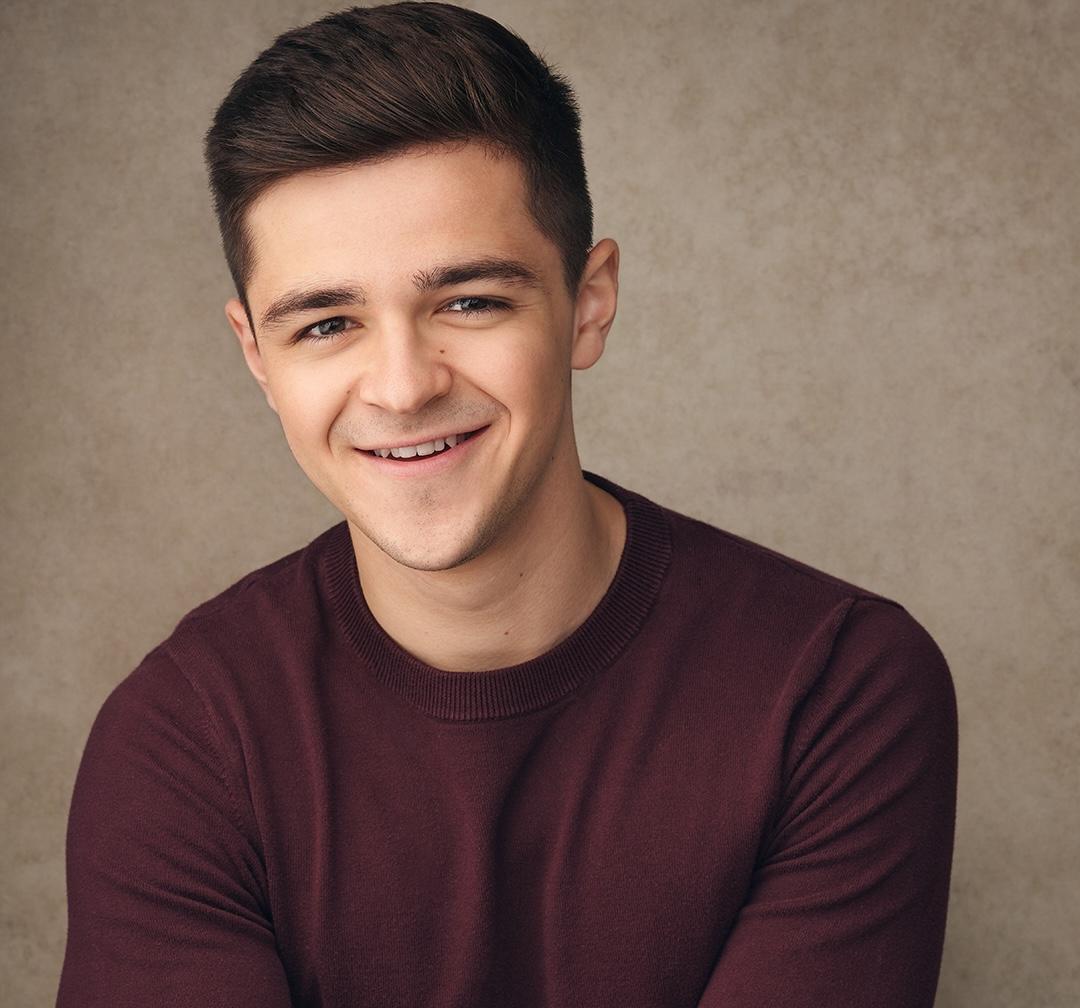 White man with short dark brown hair