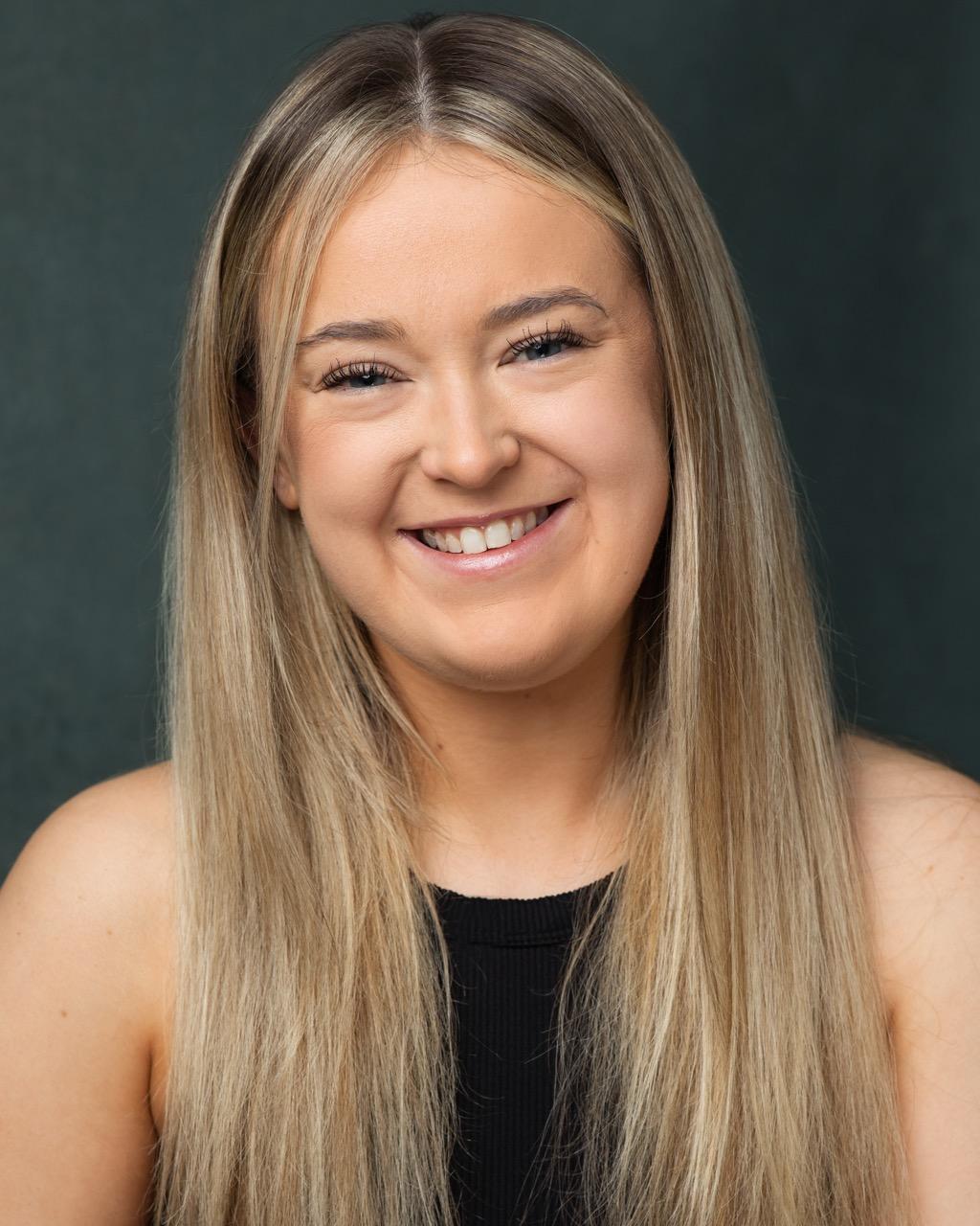 White woman in her 20s with long blonde hair