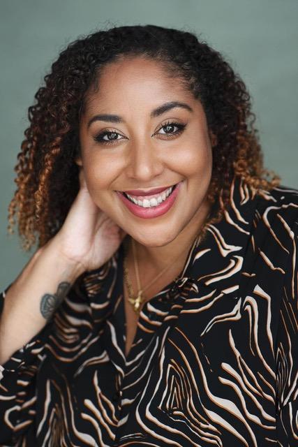 Black woman with brown curly hair