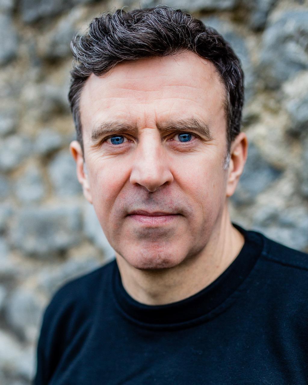 White man with short dark hair