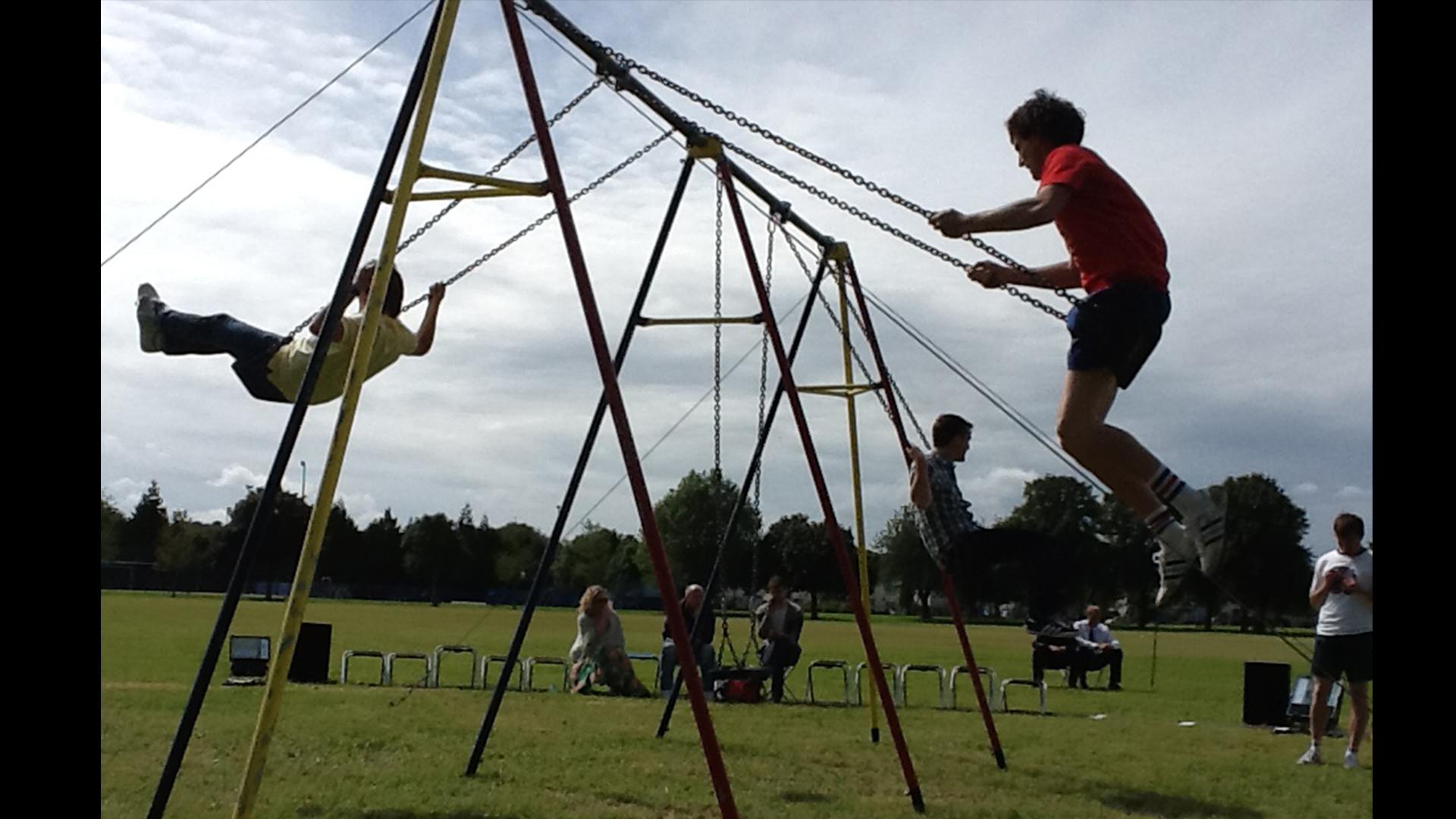 Two people on swings