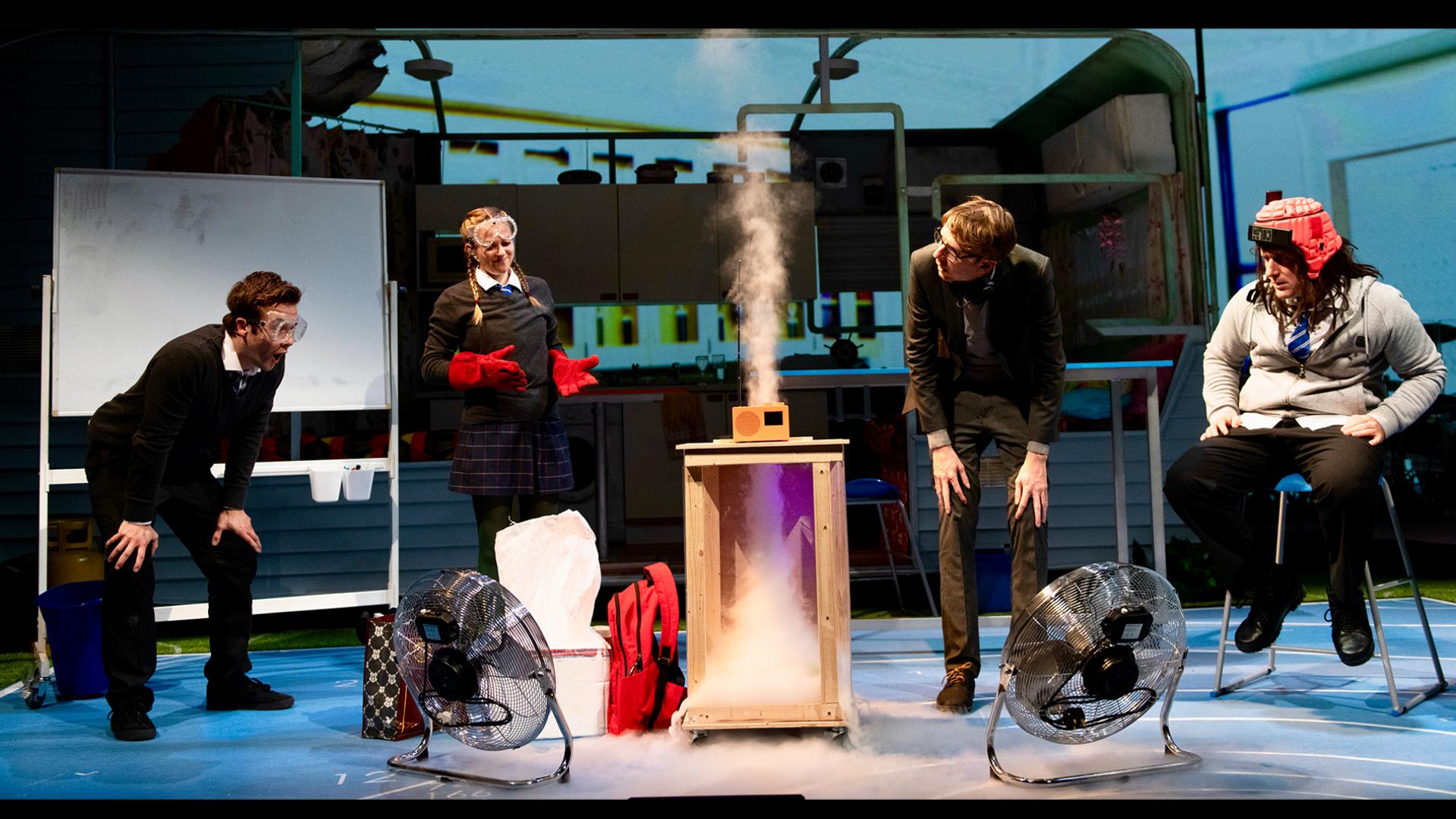 Pupils in the science room conducting an experiment to make an artificial tornado