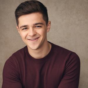 White man with short dark brown hair
