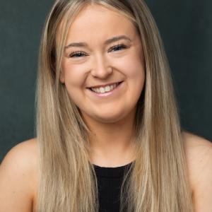 White woman in her 20s with long blonde hair