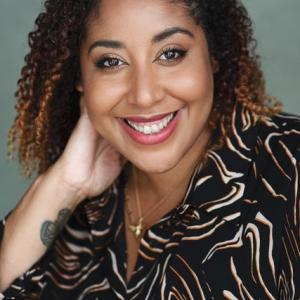 Black woman with brown curly hair