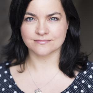 White woman with mid length brown hair