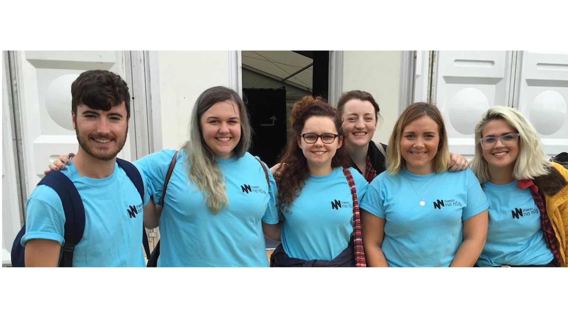 Six young people wearing blue Theatr na nÓg t-shirts